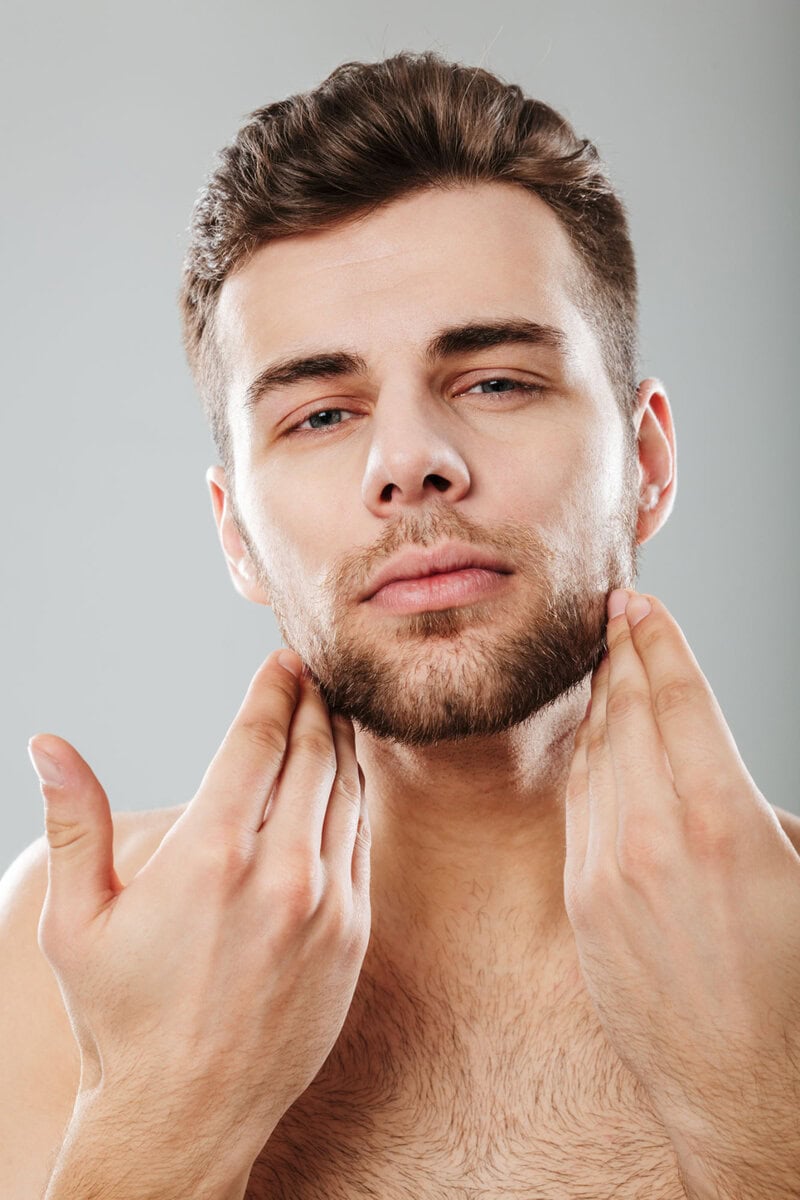 close up portrait of a young bearded man