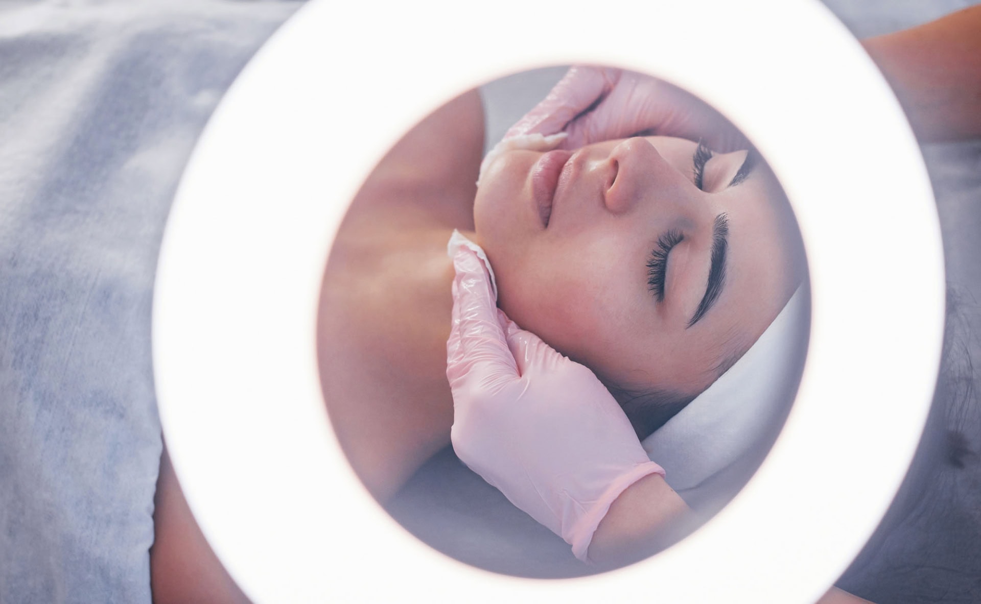 close up view of woman that lying down in spa salon and have face cleaning procedure