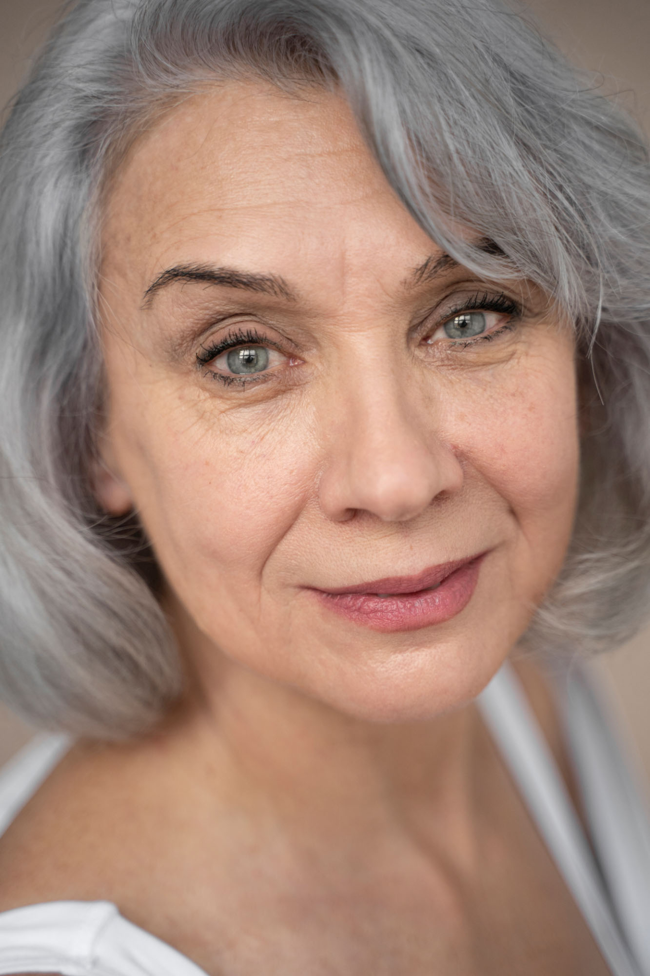 elegant old woman wearing white clothes