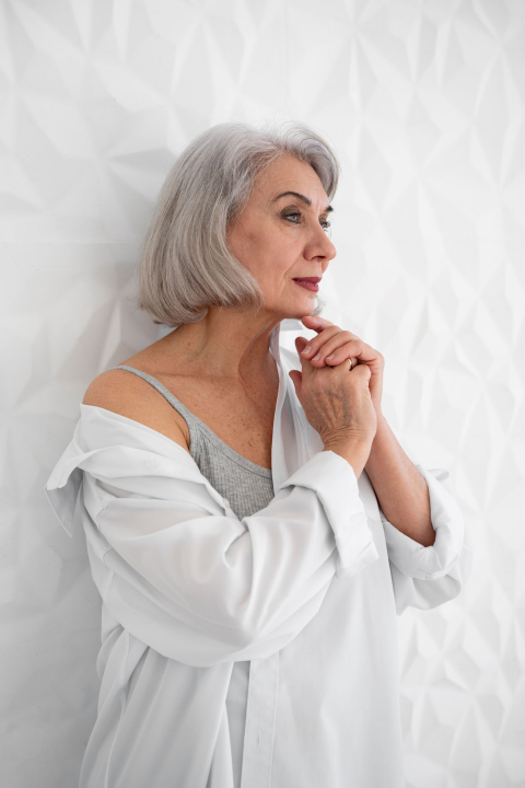 medium shot smiley senior woman indoors