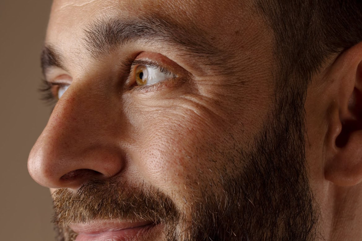 side view smiley man with beard