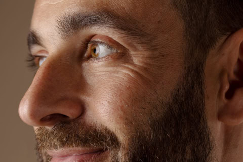 side view smiley man with beard