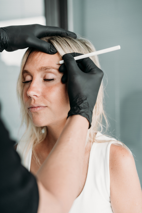 young woman gets beauty facial injections in salon or clinic. skincare concept